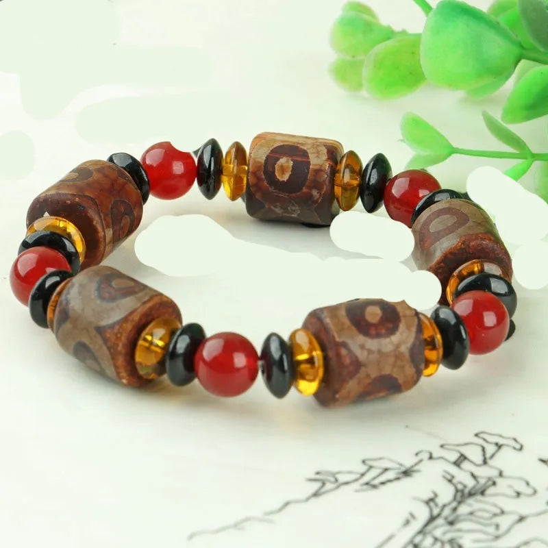 Agate Tibetan dzi bead bracelet with three-eye design and polished finish