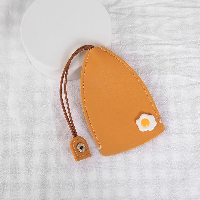 Cartoon pull-out key case in PU leather showing design options including resin fruit and big cartoon animal prints.