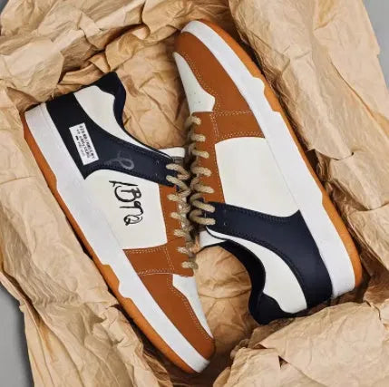 Simple white and blue lace-up sneakers on a plain background, showing the wear-resistant sole and classic design.