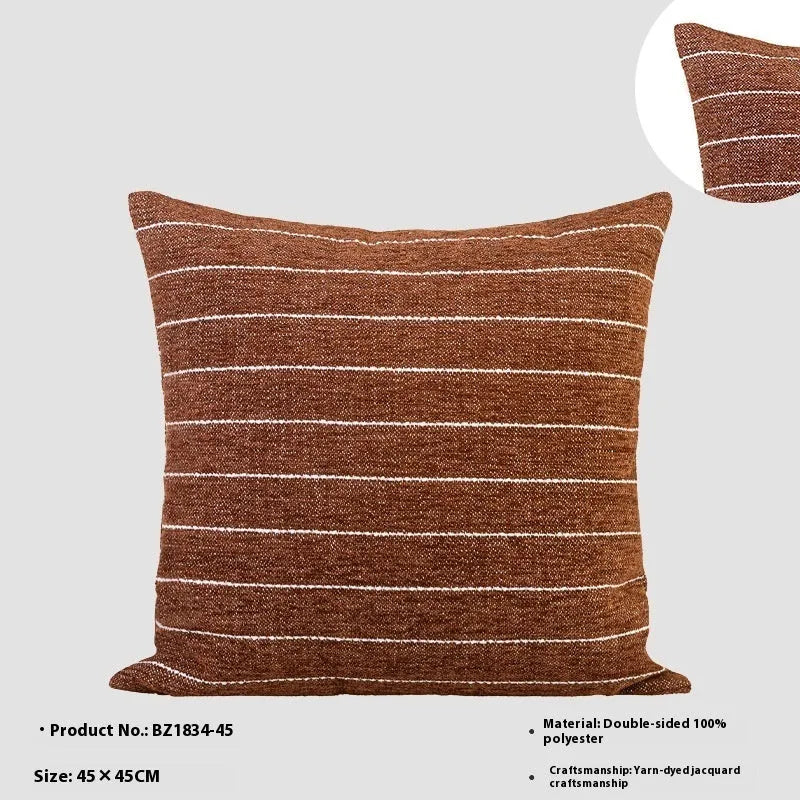 Chinese style square cushion in Maillard colour on a sofa, 45cm size with geometric pattern.