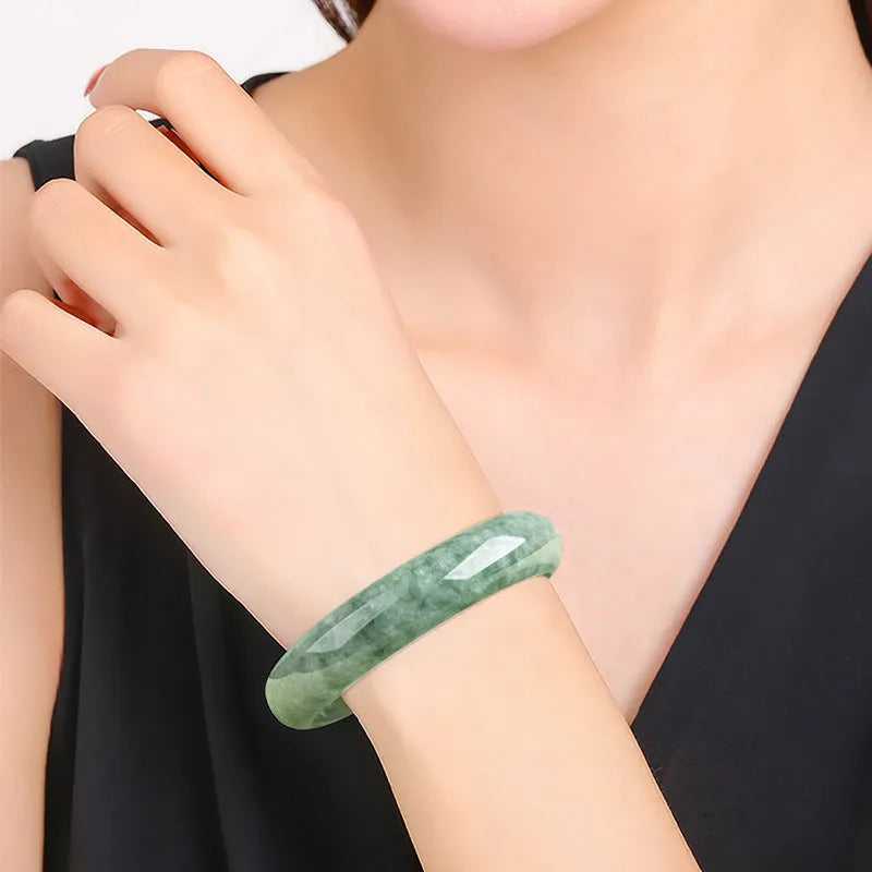 Deep pea green jade bracelet for women on a gift box, with certificate.