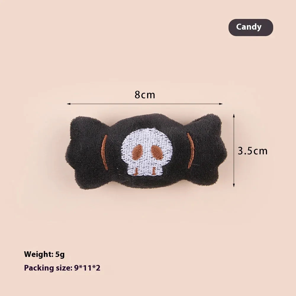 Plush cat wand toy with 27cm handle showing three interchangeable colourful heads: eyes, candy, and skull designs