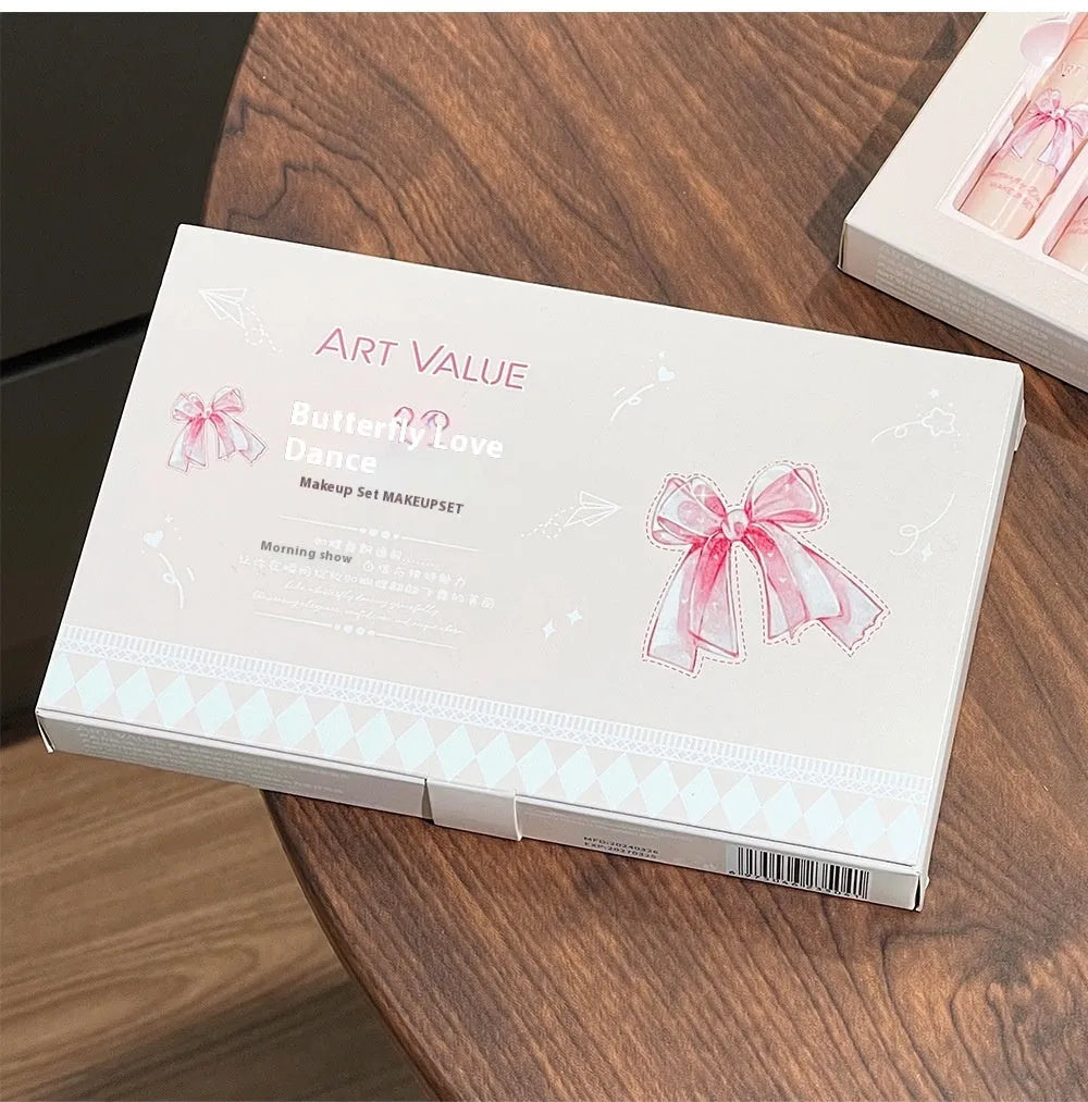 Butterfly Box makeup set with four lip muds, powder blusher and necklace in pink packaging