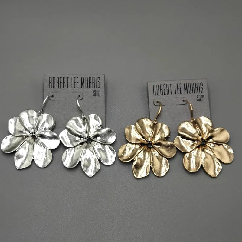Vintage-style distressed leaf earrings for women in alloy, original silver colour finish on a plain background