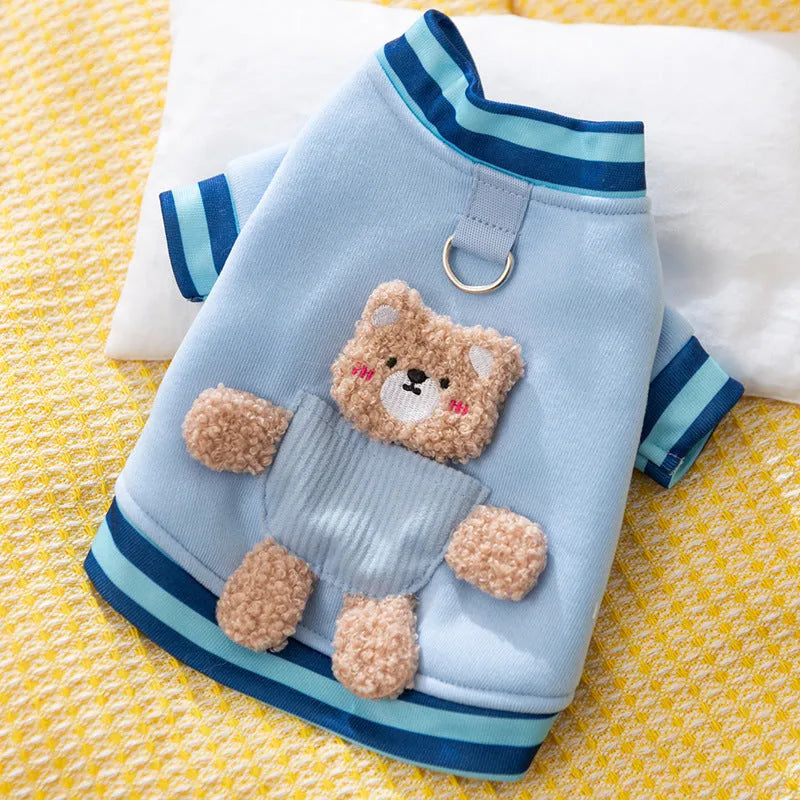 Soft navy blue dog sweater with light blue striped cuffs and blush bear decorations