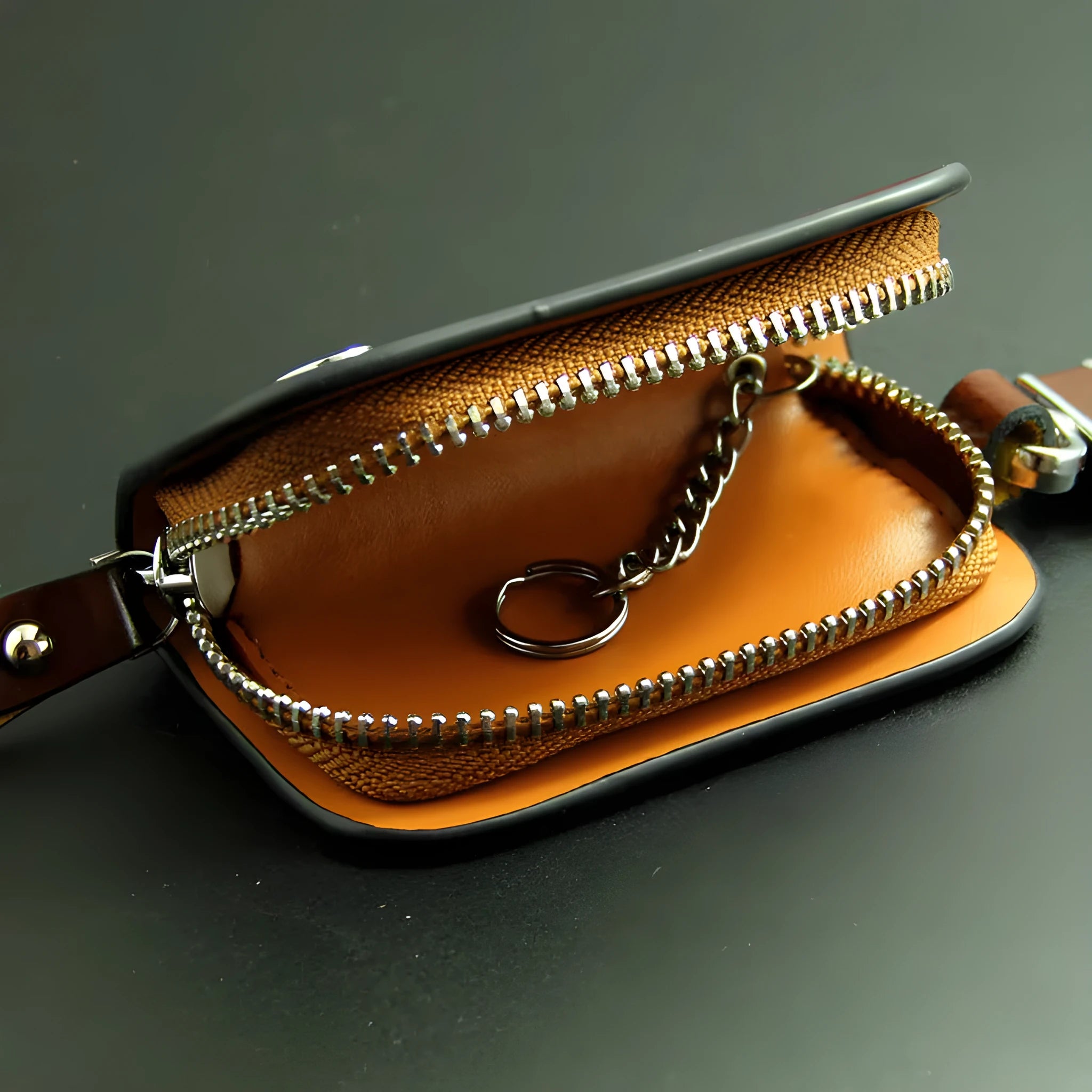 Genuine leather car key case in frost black and brown, showing soft cowhide material and size.