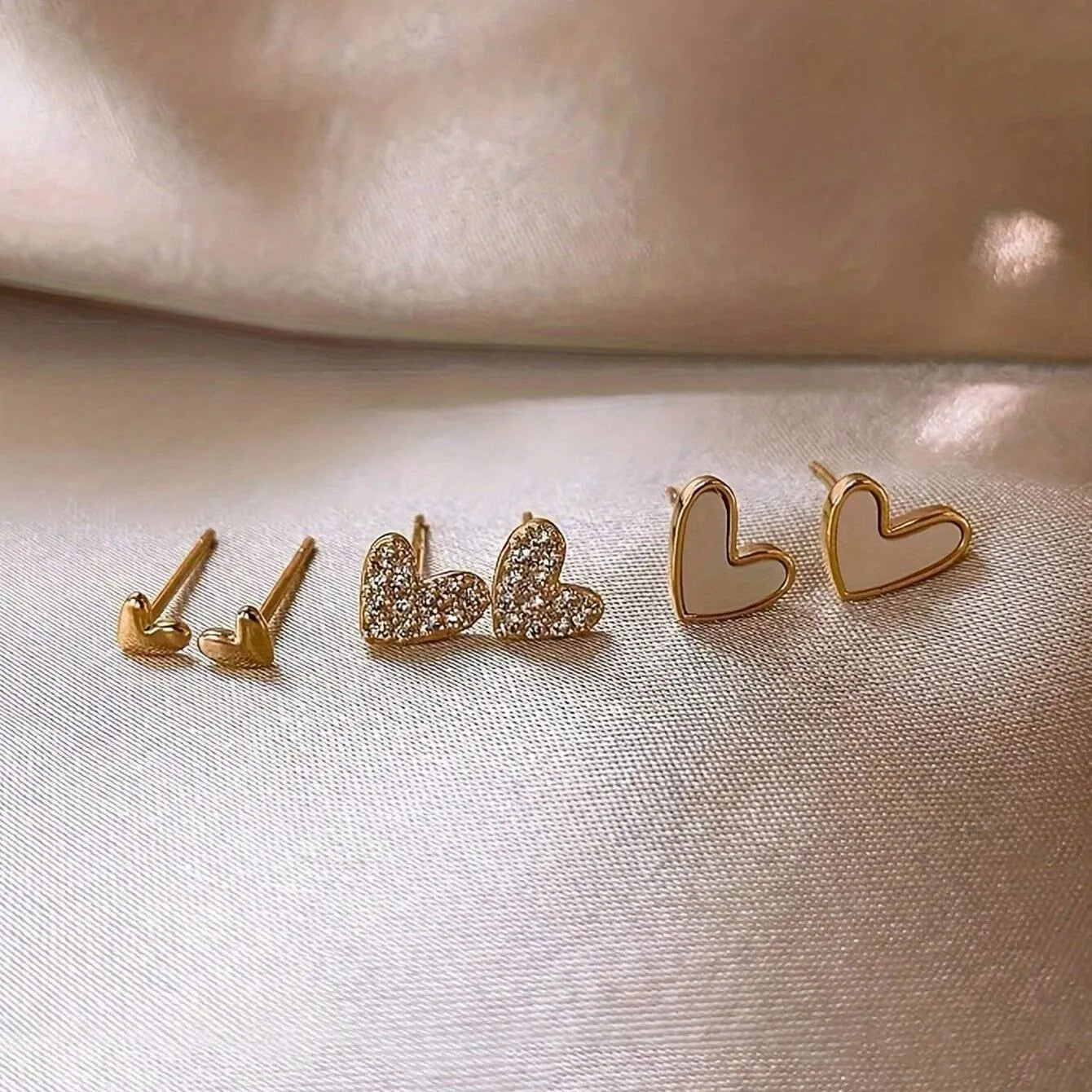 Three pairs of heart-shaped electroplated alloy earrings in girly style with love elements