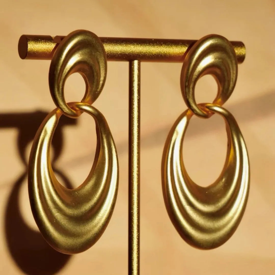Quicksand gold coloured double circle French retro drop earrings with a U-shaped silhouette.