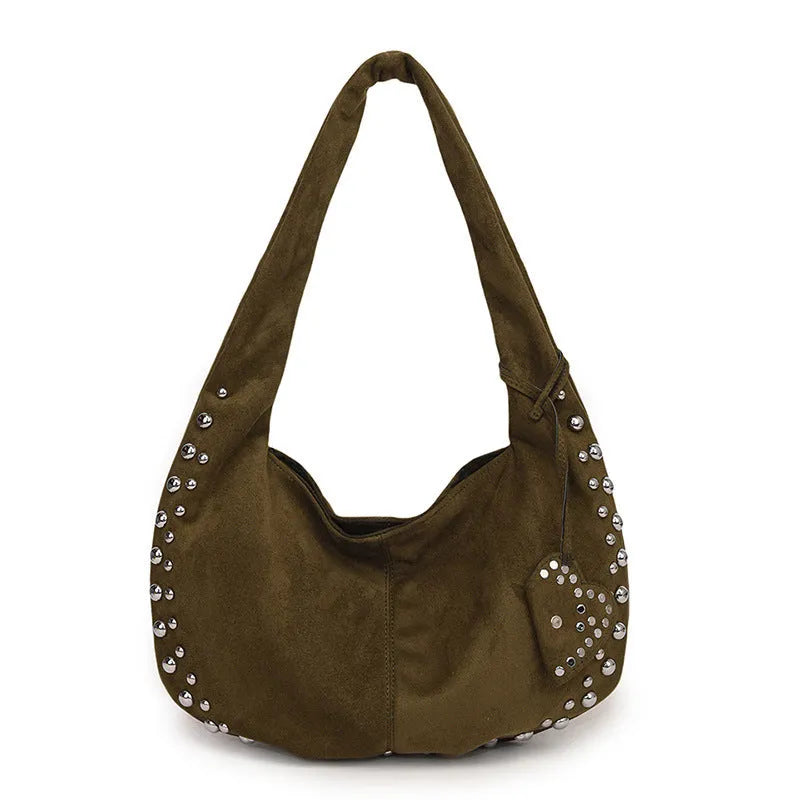 A soft plush underarm tote handbag in a retro style, shown in a colour option.