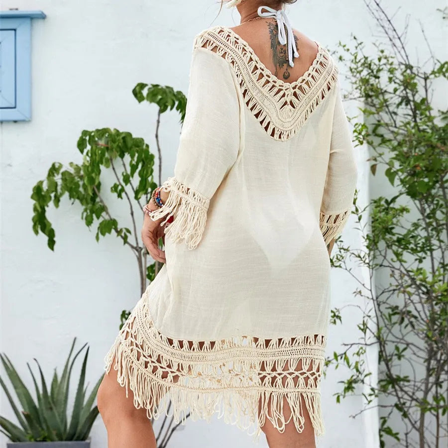 Apricot coloured women's crochet patchwork midi dress with half sleeves on a hanger.