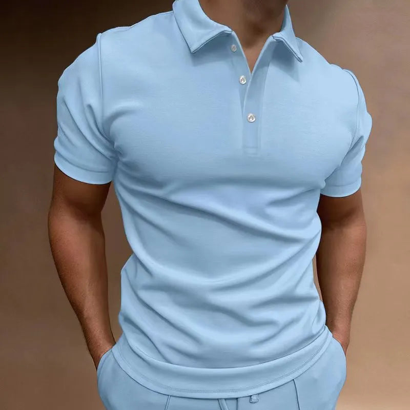 Man wearing a grey loose fit cotton blend short sleeve t-shirt for casual leisure wear.