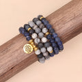 Layered multi-strand bracelet with blue patterned network stone beads and alloy toggle clasp