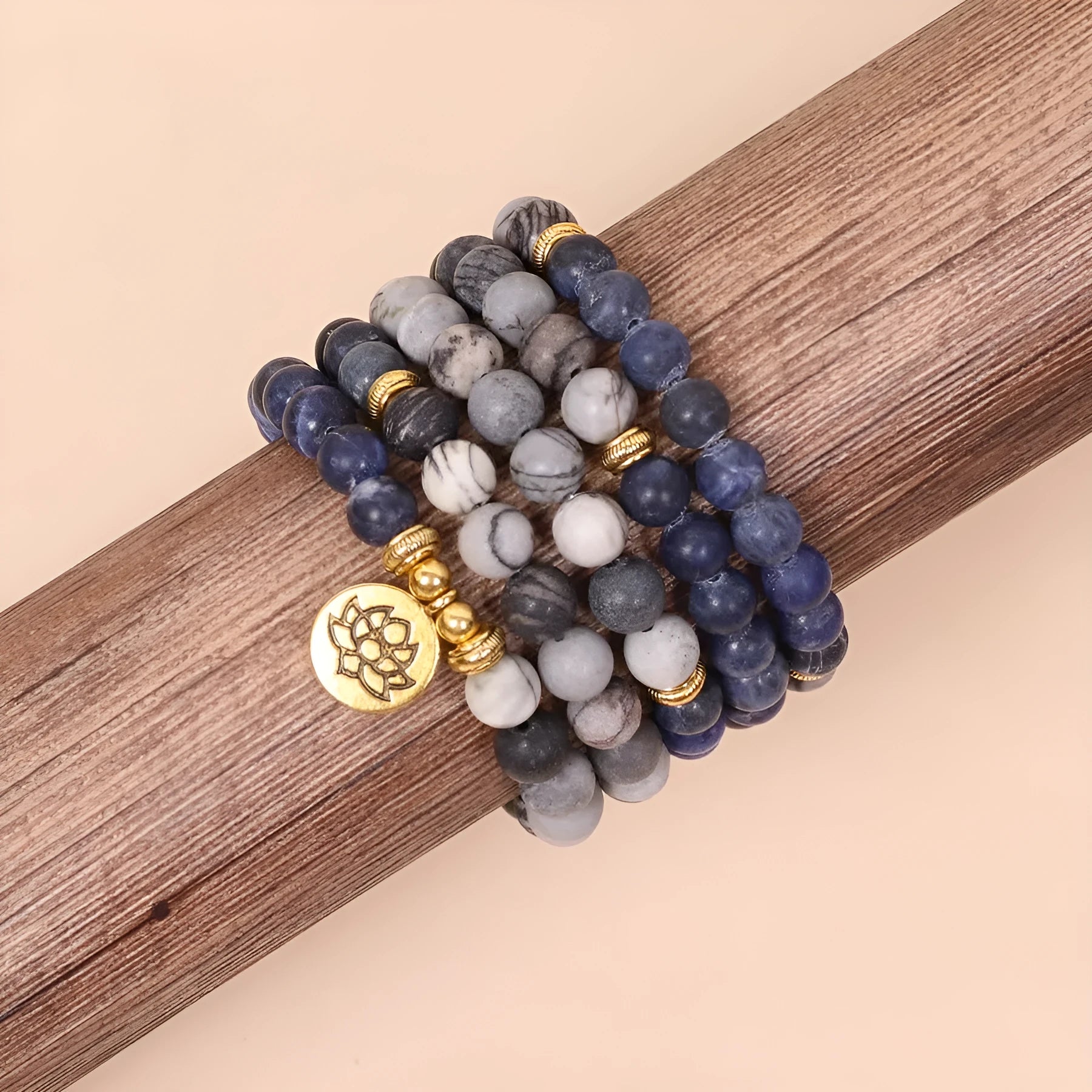 Layered multi-strand bracelet with blue patterned network stone beads and alloy toggle clasp