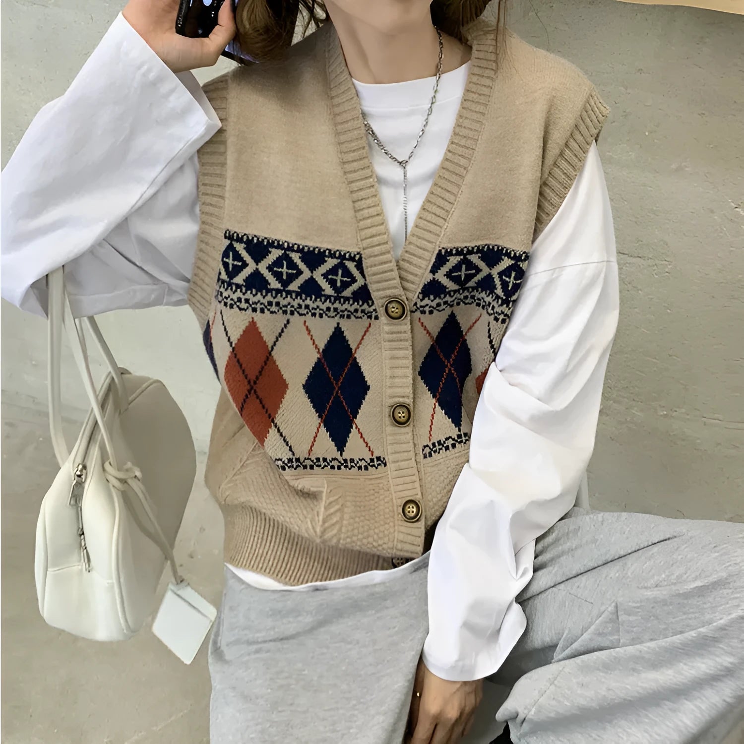 Diamond plaid sleeveless cardigan top in loose fit showing khaki colour option