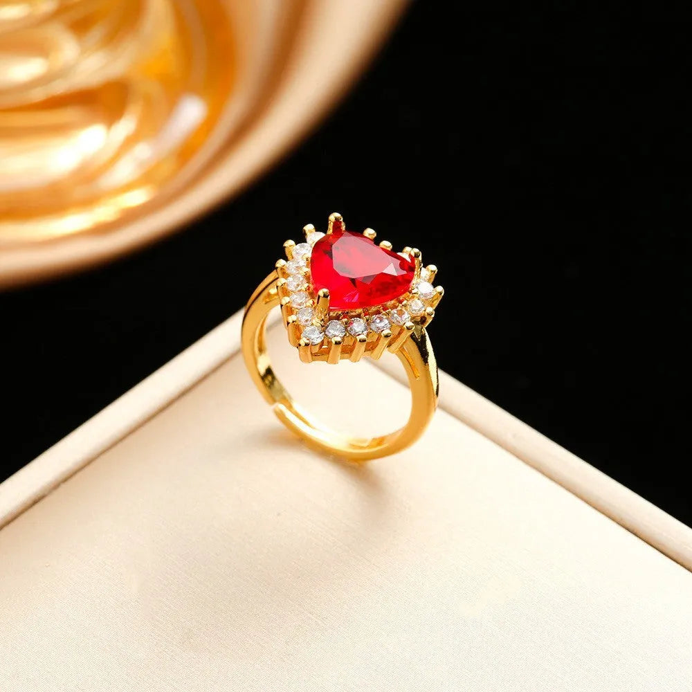 Gold red titanium steel jewellery set with hearts and flower pendant including necklace, ear studs, and ring