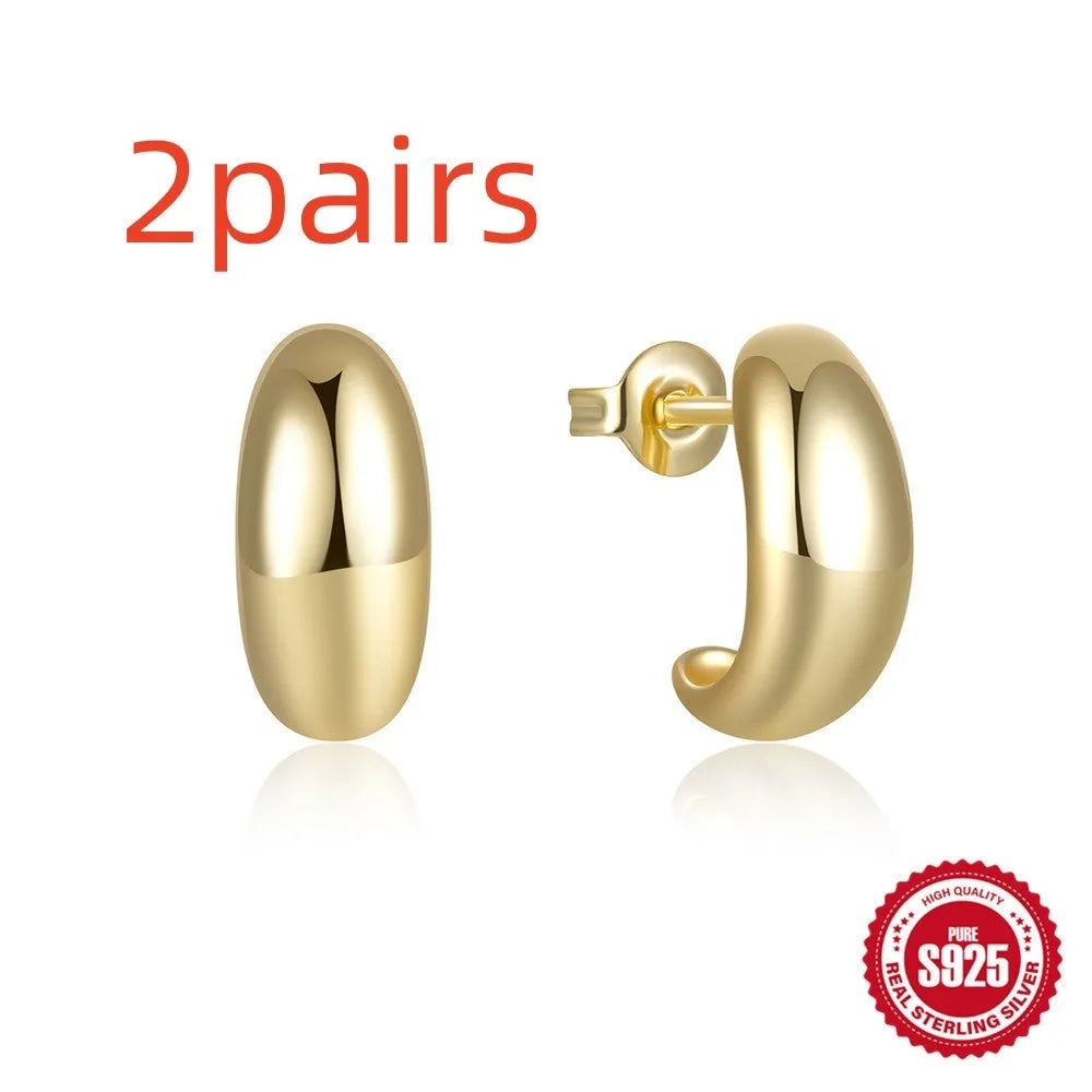 Sterling silver C-shaped geometric stud earrings with glossy electroplated finish