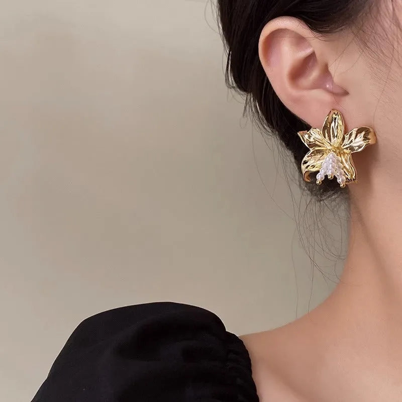 Gold H1795 pearl flower earrings with exaggerated floral design and Seiko-treated metal construction