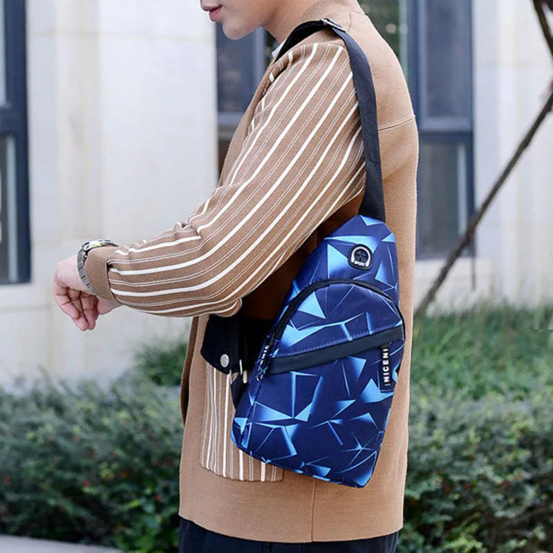 Men's Oxford cloth crossbody chest bag with earphone hole, showing zipper closure and vertical messenger style