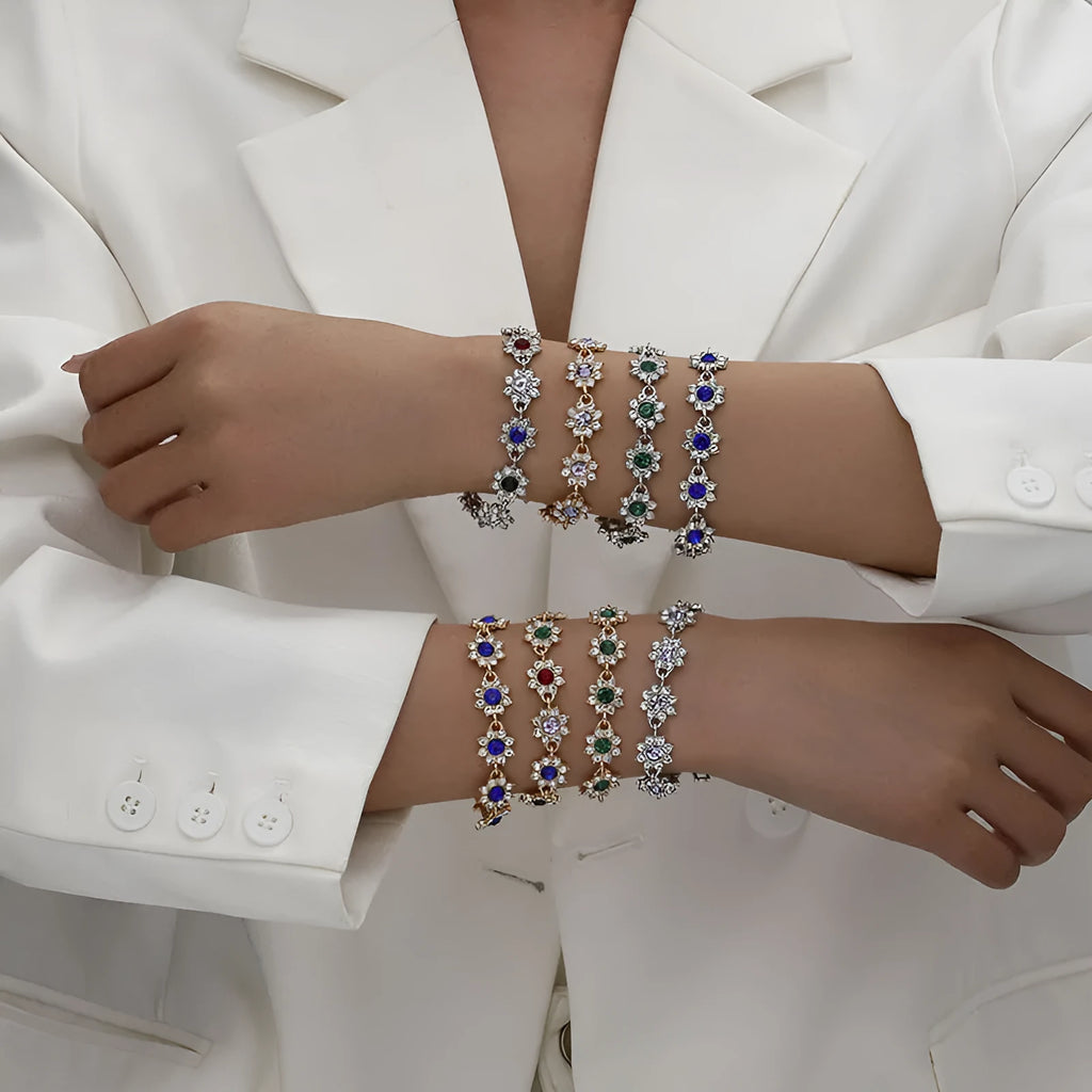 Floral-shaped zinc alloy bracelet with electroplated finish in gold and silver colour options.