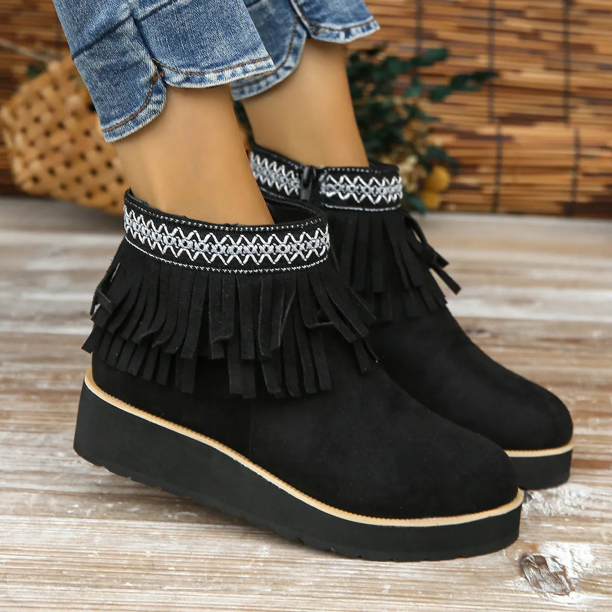 Women's dark brown suede wedge ankle boot with side zip, tassel, and thick rubber sole.