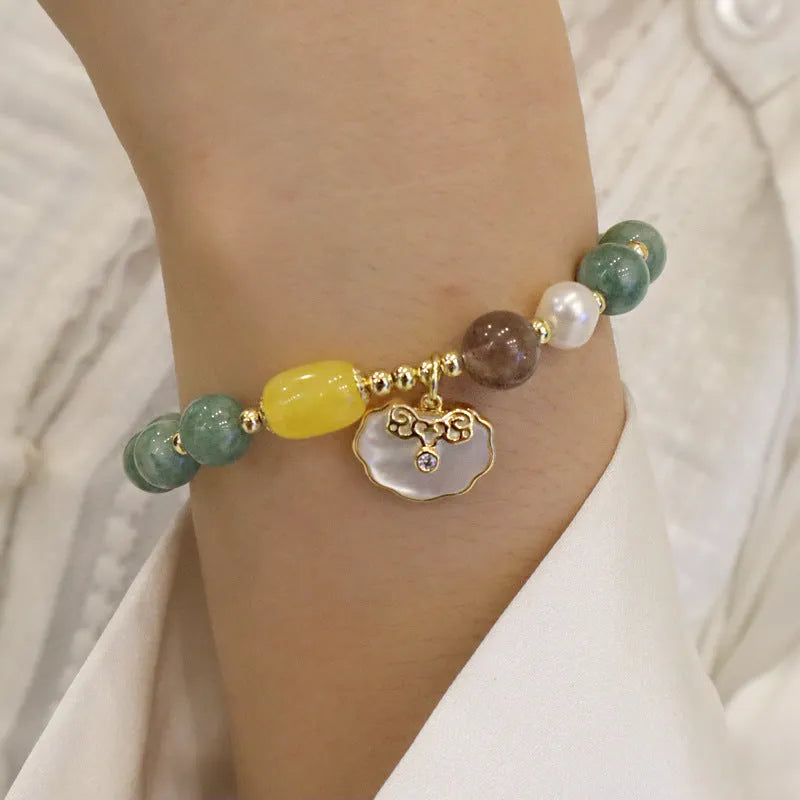 Women's casual bracelet with a single green jade bead on an adjustable band.