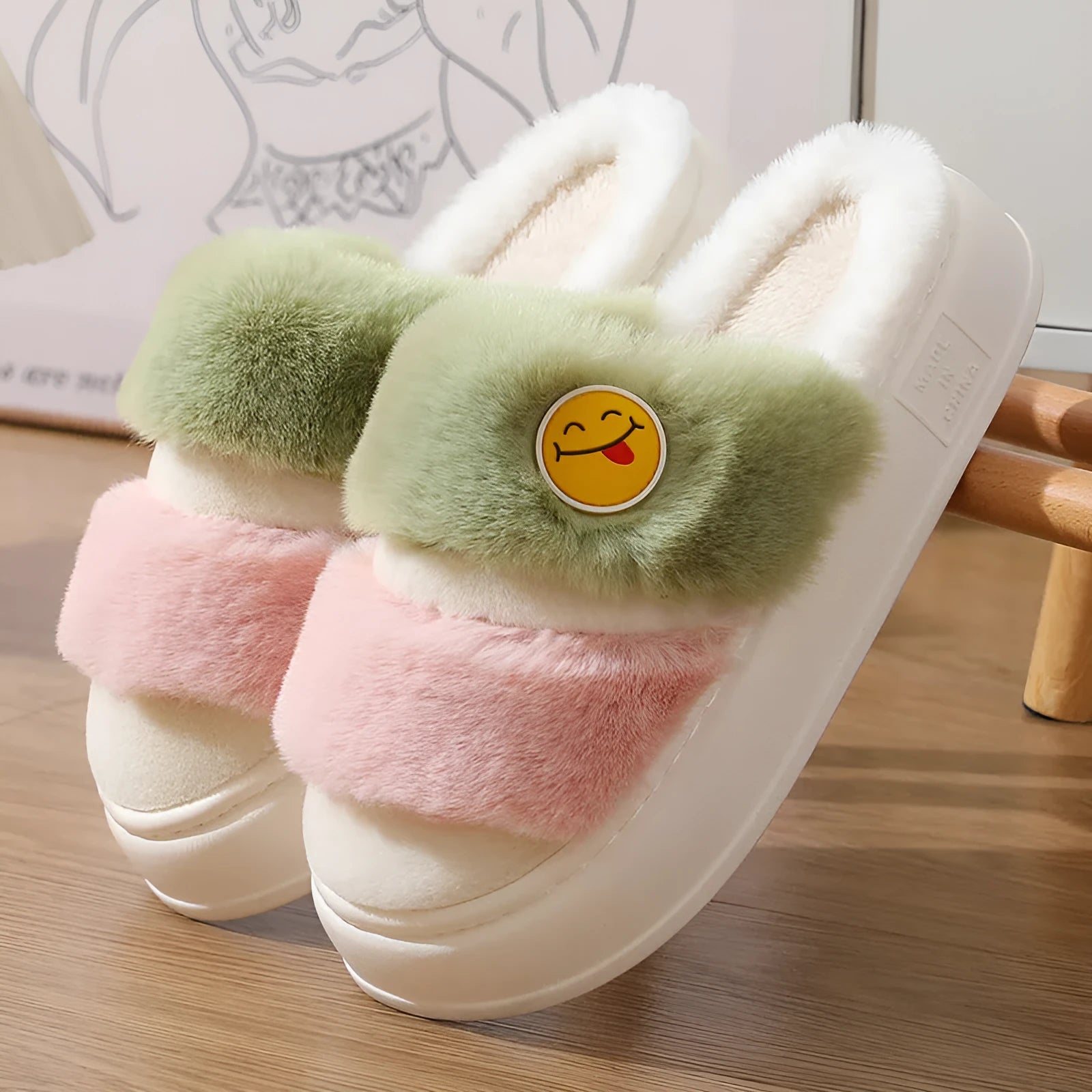 Pink and green thermal cotton slippers with plush upper and non-slip sole.