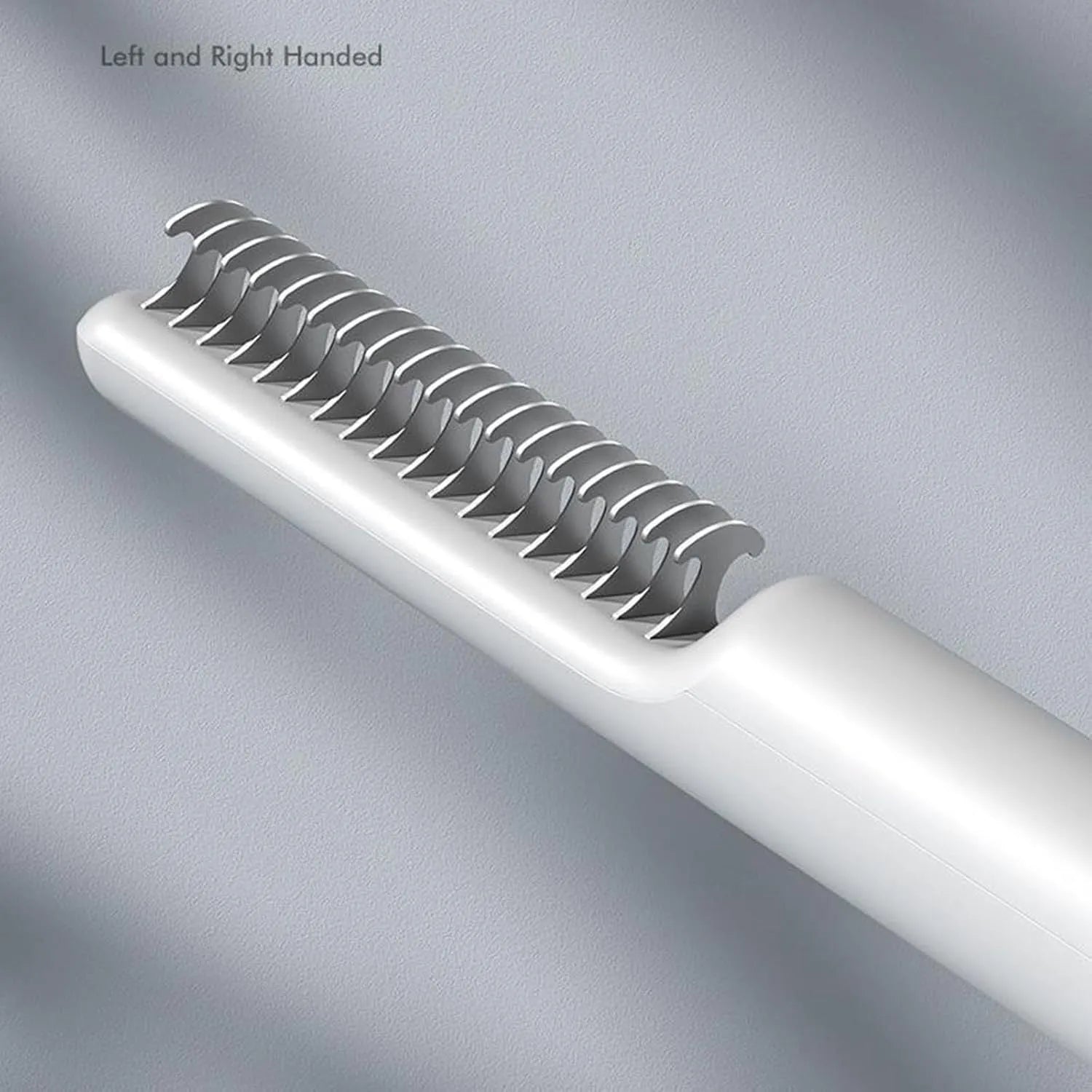 Stainless steel dog dematting comb with ergonomic handle in pink colour on white background