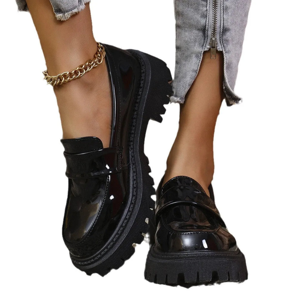 Women's black slip-on loafers with chunky platform heel and solid colour design