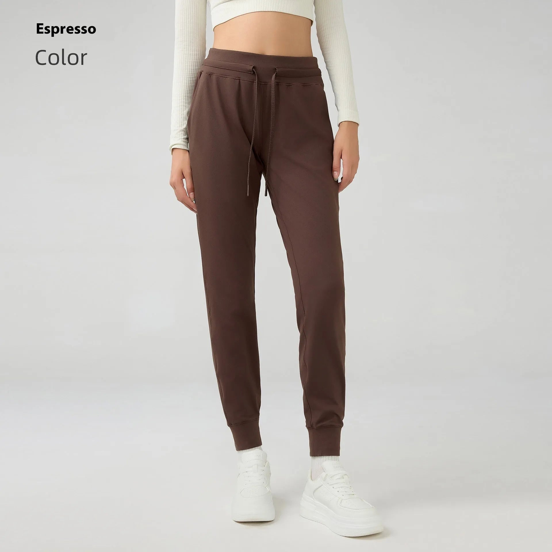 Women's high-waist yoga pants with drawstring waistband in distilled coffee colour, suitable for fitness.