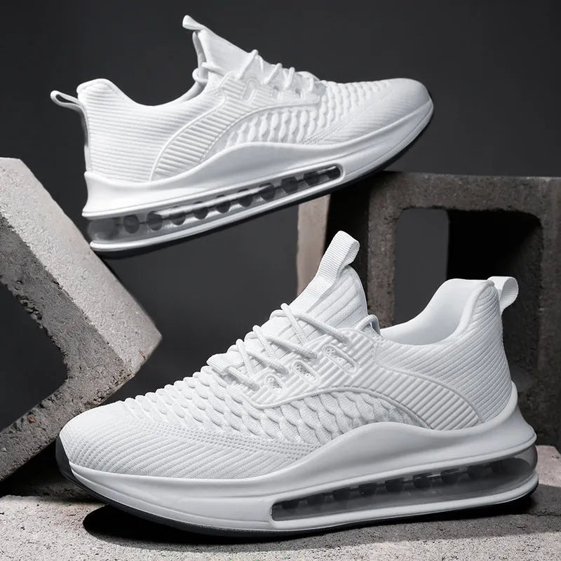 Men's black mesh running shoes with platform sole and round toe design on white background