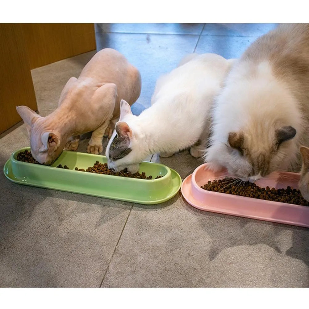 Set of four green pet feeding bowls with non-slip bases for cats and dogs