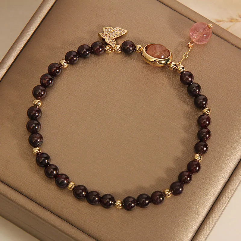 Black stone micro inlay butterfly pendant bracelet on wrist
