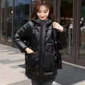 Women's loose fit hooded winter jacket in green colour showing long sleeves and thick insulation