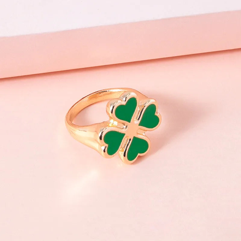 Four leaf clover ring in silver colour with enamel detailing on zinc alloy band, 17mm size