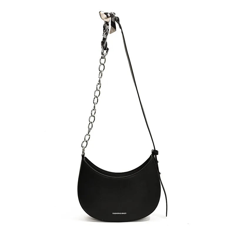 Small PU leather saddle bag on a flat surface, available in black, brown, coffee, green, khaki, and white