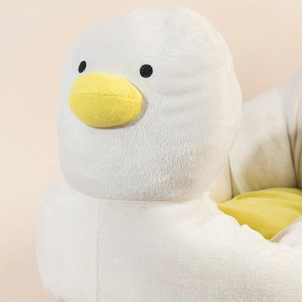 Blue duck-shaped fluffy pet sofa bed for small dogs and cats on a white background.