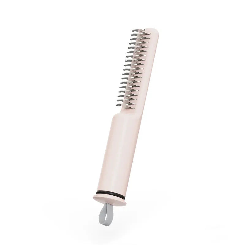 Stainless steel dog dematting comb with ergonomic handle in pink colour on white background