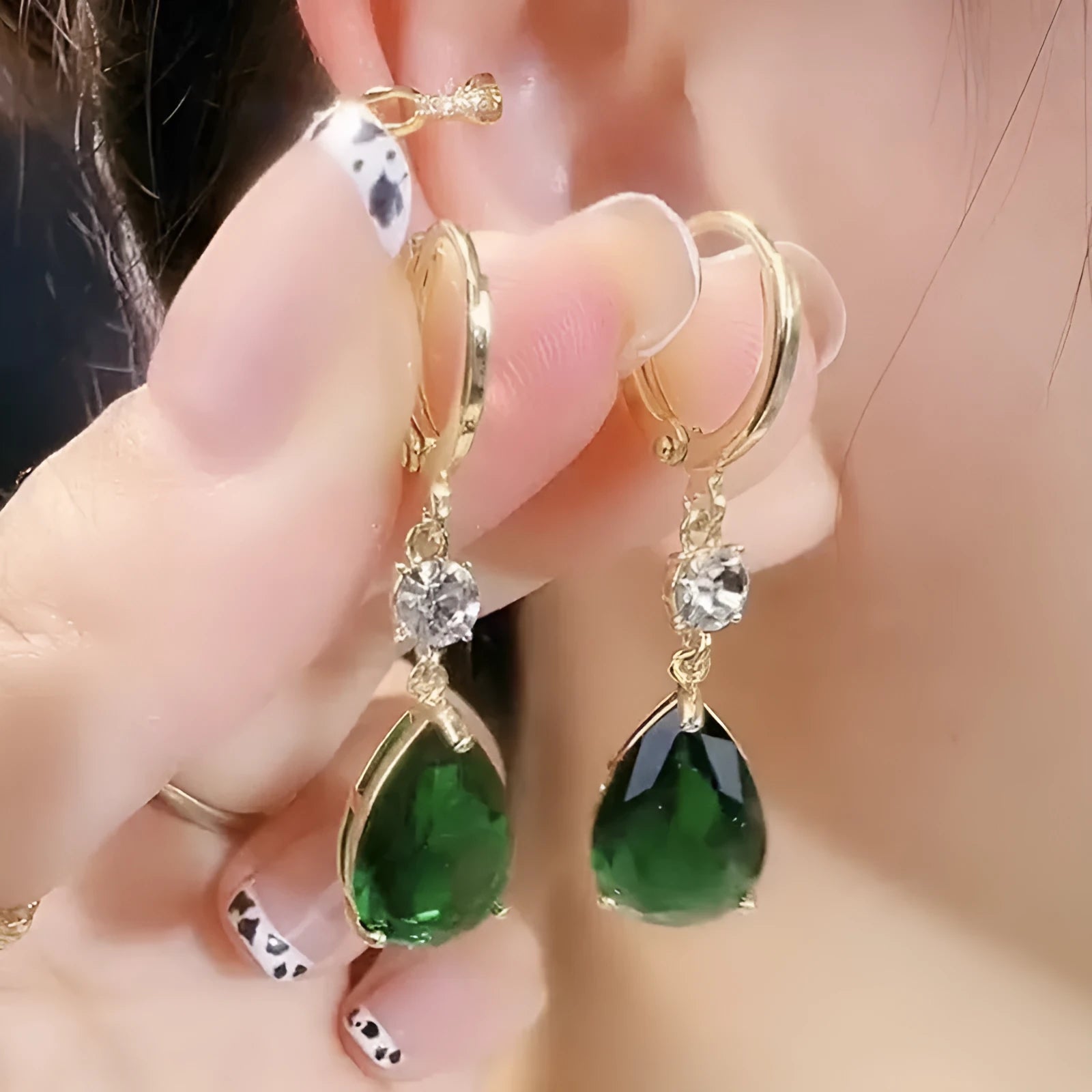 Green geometric teardrop alloy earrings showing structured design from multiple angles