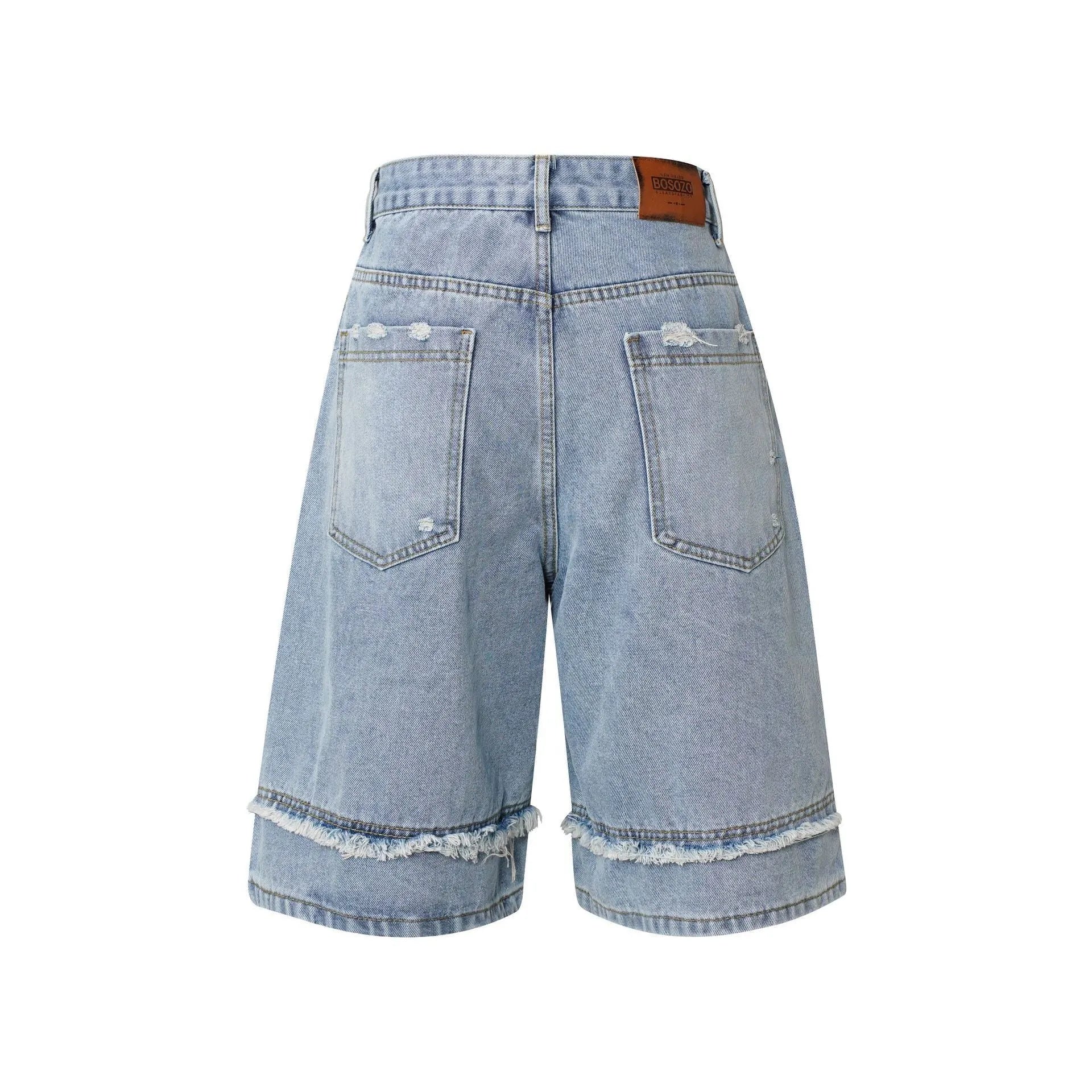 Distressed denim shorts with raw edge detailing in straight cut and cropped leg length