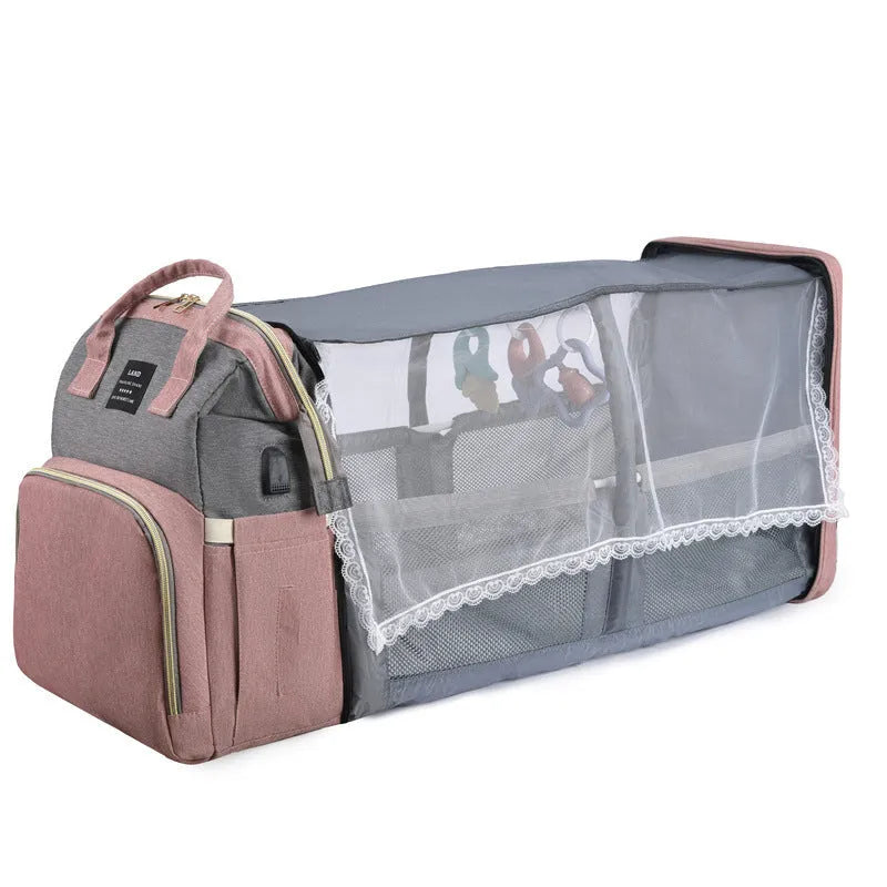 Large capacity insulated baby crib backpack in pink grey with double shoulder straps and outer pocket on white background
