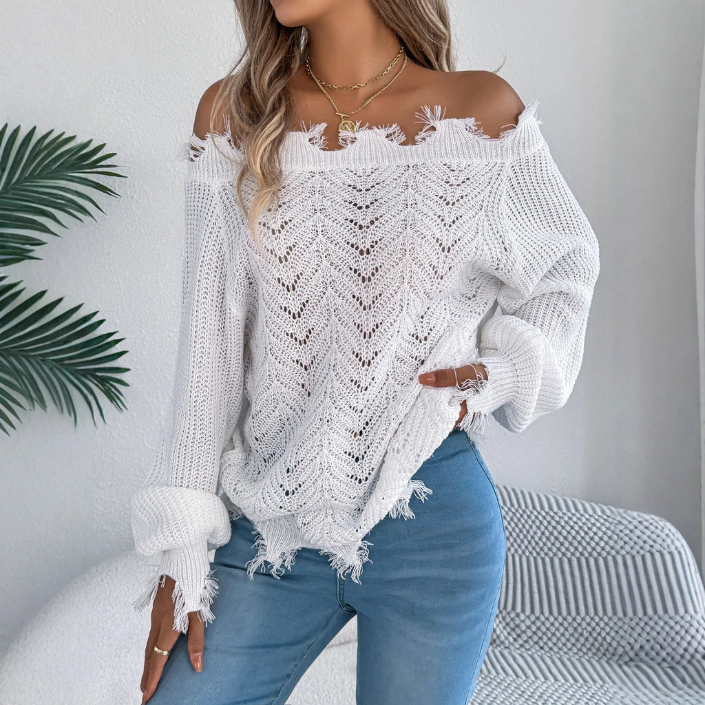 Women's white hollow-out knitted pullover sweater with cut off-the-shoulder neckline and long sleeves.