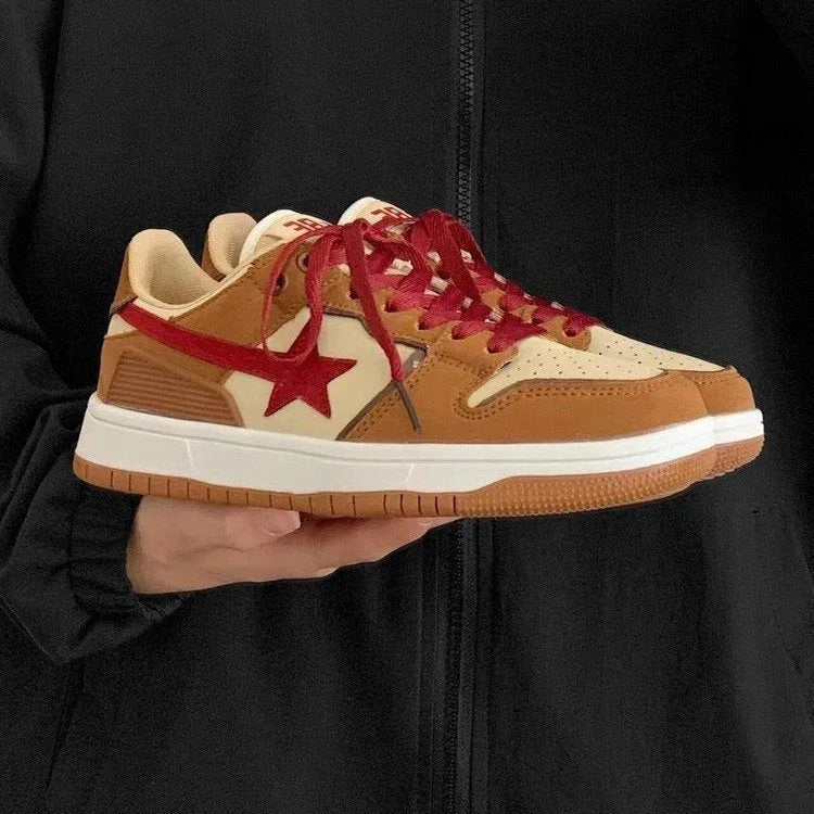 Brown women's lace-up platform sneakers with sequin details and a rubber sole.