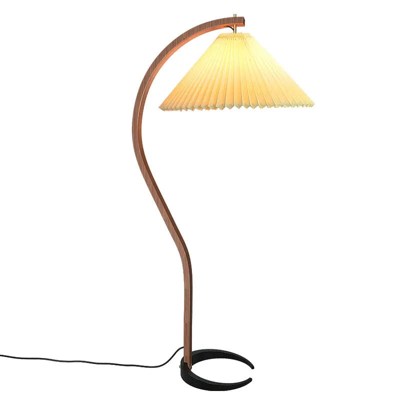 Retro vertical table lamp with tall stand and choice of log white or wine red shade on a bedside table.