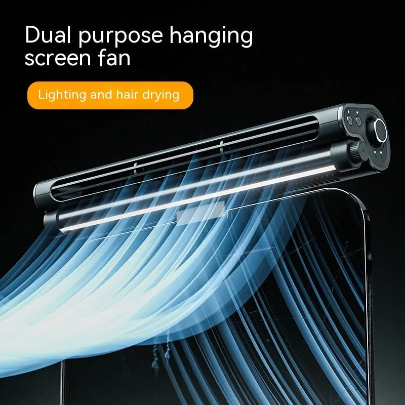 Black bladeless USB fan clipped to laptop screen with integrated lighting lamp showing brushless motor design