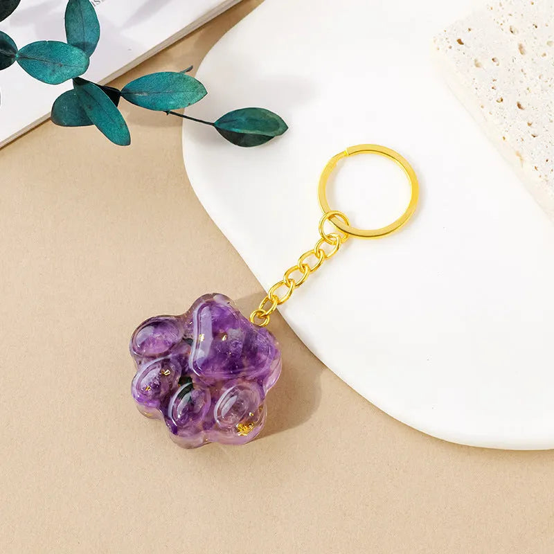 Small natural crystal cat's paw shaped pendant on a metal keyring, available in various crystal colours.