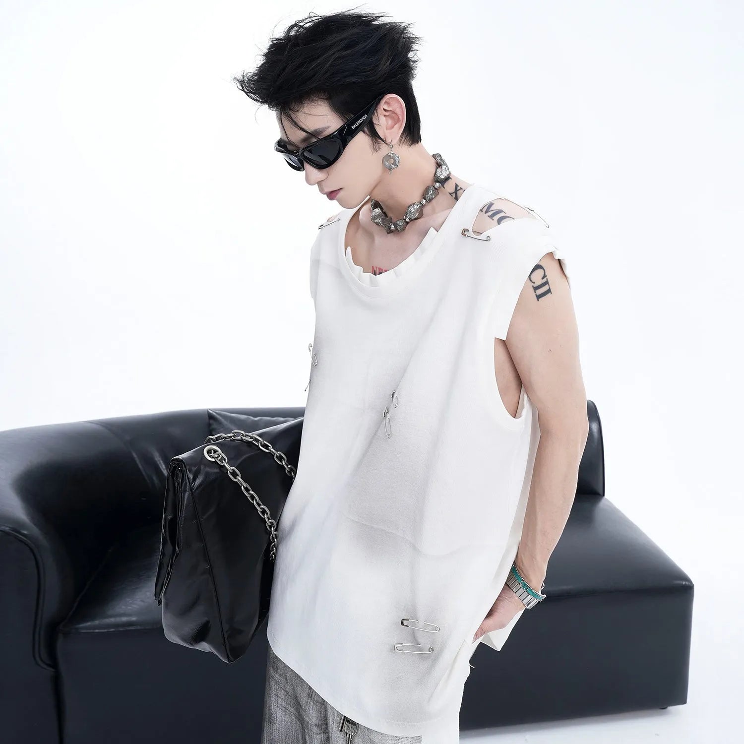 Men's black vest waistcoat with irregular cutting and ripped detailing, sleeveless round neck design