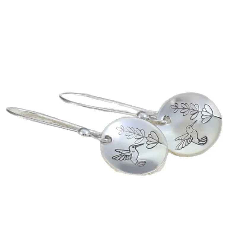 Silver women's earrings with bird and flower motifs on glossy round zinc alloy design
