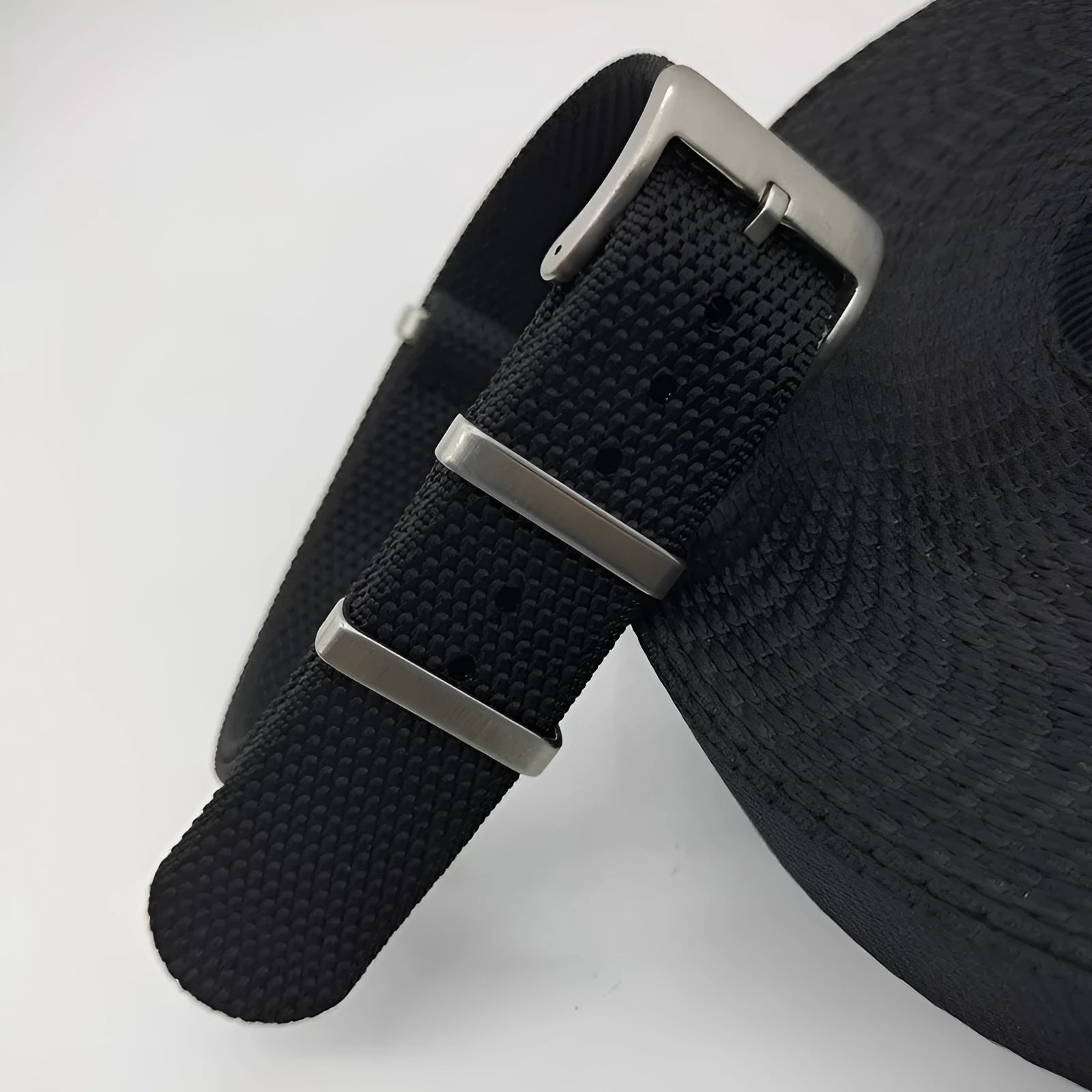 Nylon quick-release watch strap in army green colour showing integrated spring bars