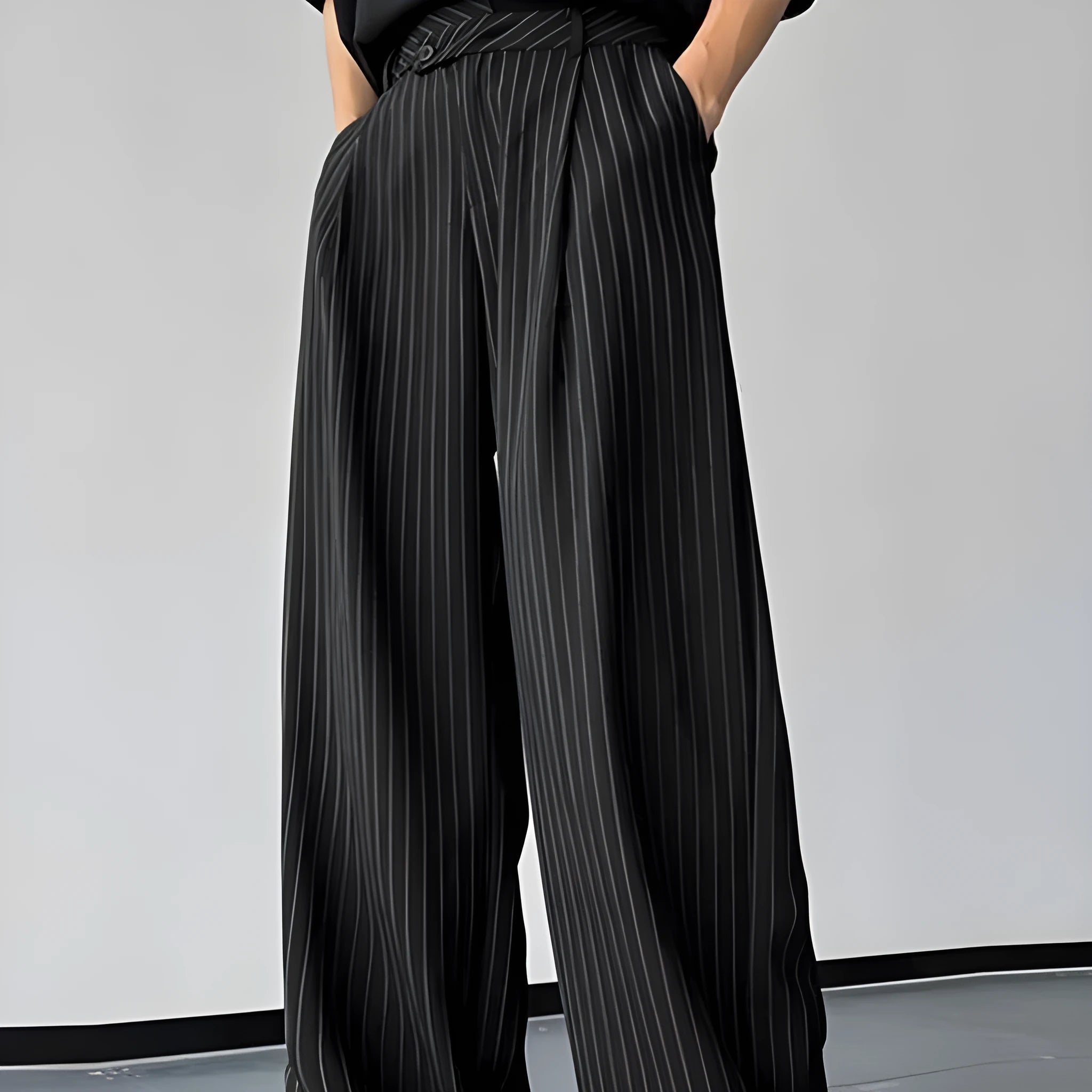 Men's black vertical striped pleated casual trousers showing front view