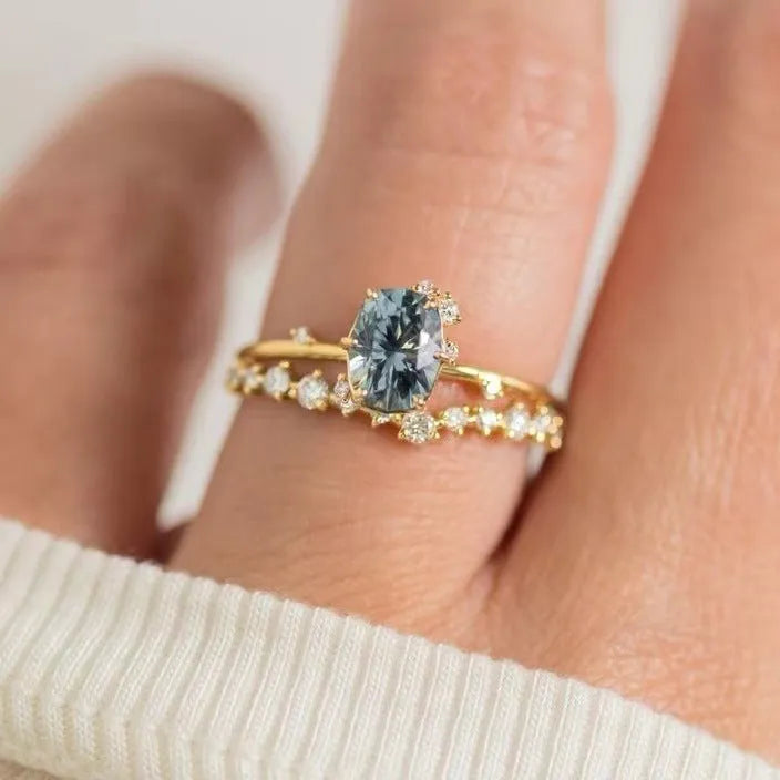 Gold electroplated women's ring with flower design featuring green zircon stones